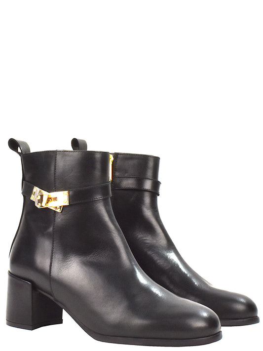 Beige ankle boot with a gold buckle 